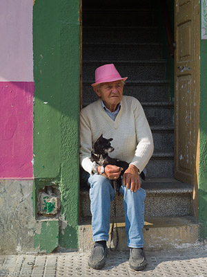man with hat and dog